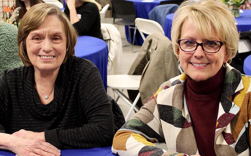 Instead of catching fish, Jan Hackett, left, and Executive Director of Fannin County Development Authority Sheree Ralston, catch up at the Back the Brookies Winter Bash hosted by the local Blue Ridge Mountain Trout Unlimited (BRMTU) chapter Saturday, January 29.
