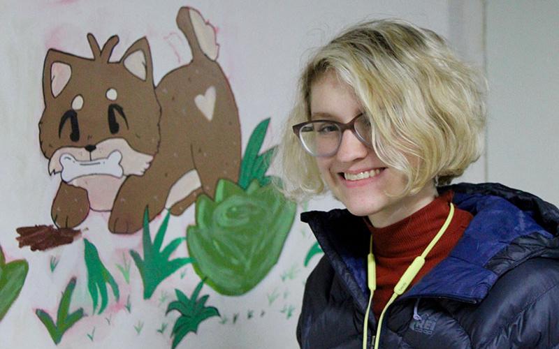 Fannin County High School Art Club members are gracing the walls of Wet Noses Pet Rescue with their talents. Shown working on part of a mural at Wet Noses is high school senior and art club member Kenna Verner.