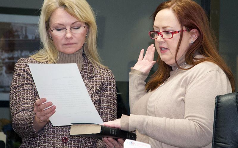 Laura Ray, right, takes her Oath of Office for the Blue Ridge Downtown Development Authority while Mayor Rhonda Haight holds the oath and Holy Bible.