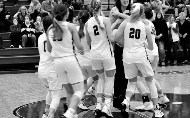 Megan is engulfed by the 2021-2022 Lady Rebels when she was introduced as a Hall of Fame inductee.