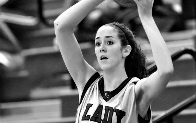 Megan looking for an open player during her days with the Lady Rebels.