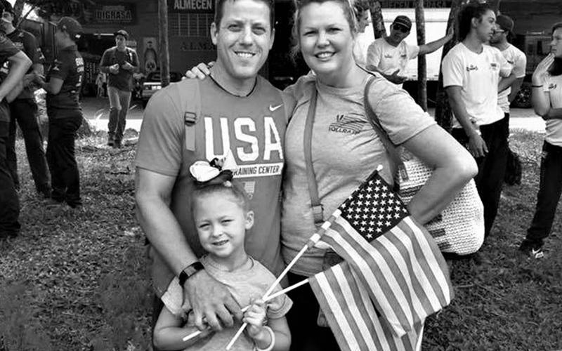 Charles Tyger Vollrath is shown with his wife Suzi and daughter Elizabeth Grace.