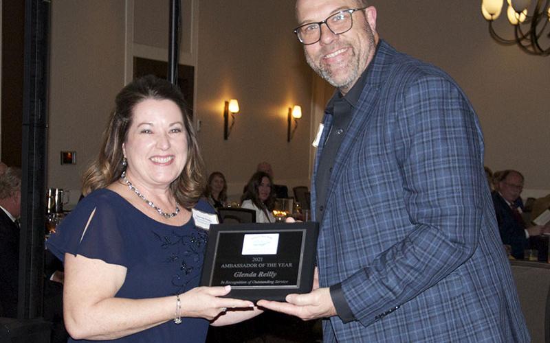 Shown is Glenda Reilly receiving the Ambassador of the Year award for her work to help welcome new businesses to the Fannin County area. Shown presenting the award is Troy Shirbroun.