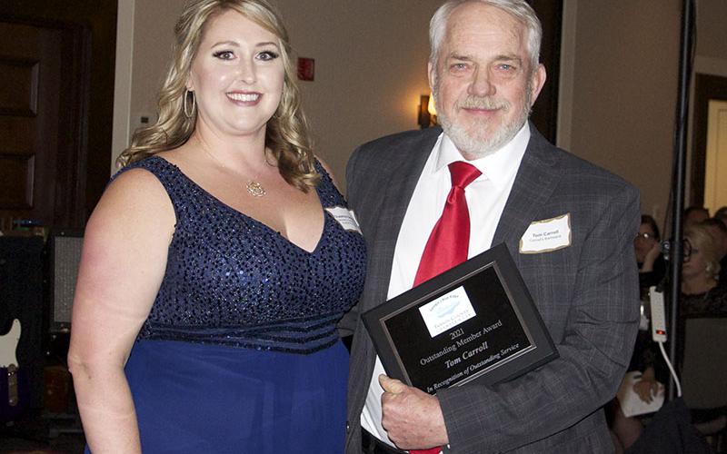 Incoming Chairwoman Elect Suzanne Stepp Davenport is shown presenting owner of Carroll’s Barbeque Tom Carroll with the Outstanding Chamber Member Award at the Chamber Banquet.