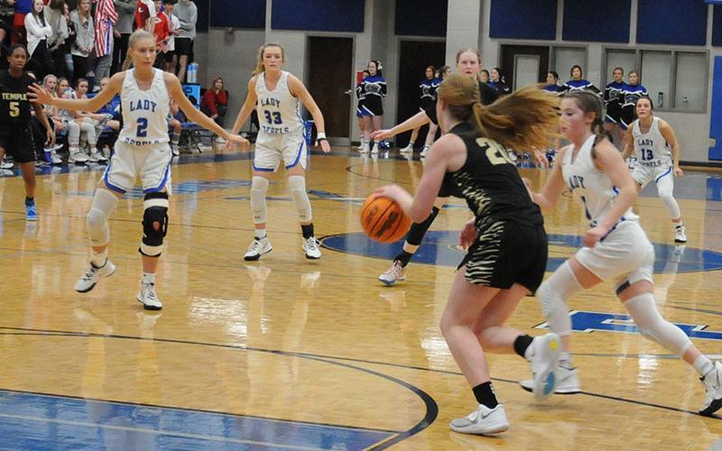 A relentless defense had been a trademark of the Fannin County Lady Rebels all season. Here, Ellie Cook, Reagan York, Courtney Davis and Becca Ledford, from left, make it hard for an opponent to get down the court.
