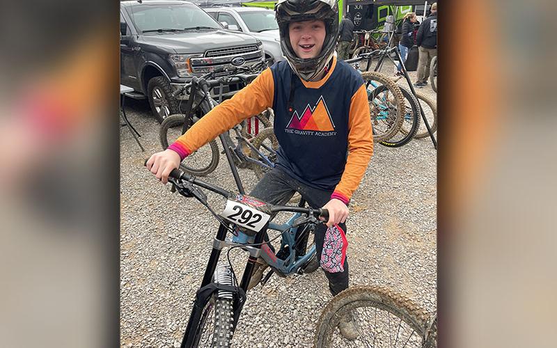Aiden Carder smiles at Windrock Bike Park during the opening round of the USA Cycling National Downhill Series.