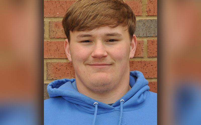 Senior Dylan Collins, school record holder for shot put, just before practice on Wednesday, March 9.