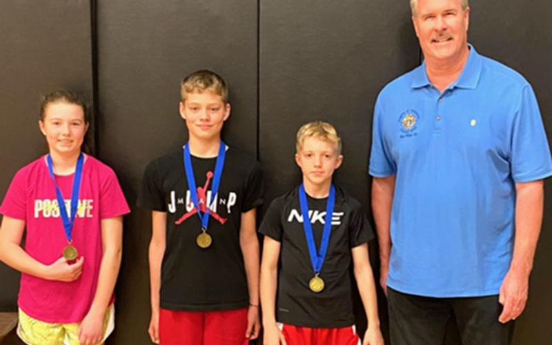 Three local youngsters placed in the annual Knights of Columbus Free Throw Championship in Atlanta. They were, from left, Taber Pass, Andrew Pero and Dawson Pittman. They are shown with Jack Devine who organized the event.