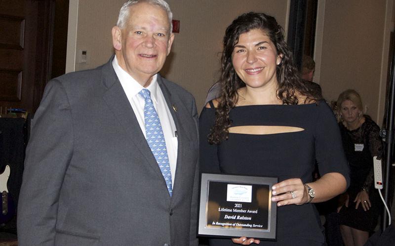 Georgia State representative and Speaker of the House of Representatives David Ralston is shown receiving an Honorary Lifetime Membership Award presented by Fannin County Chamber of Commerce President Christie Gribble.