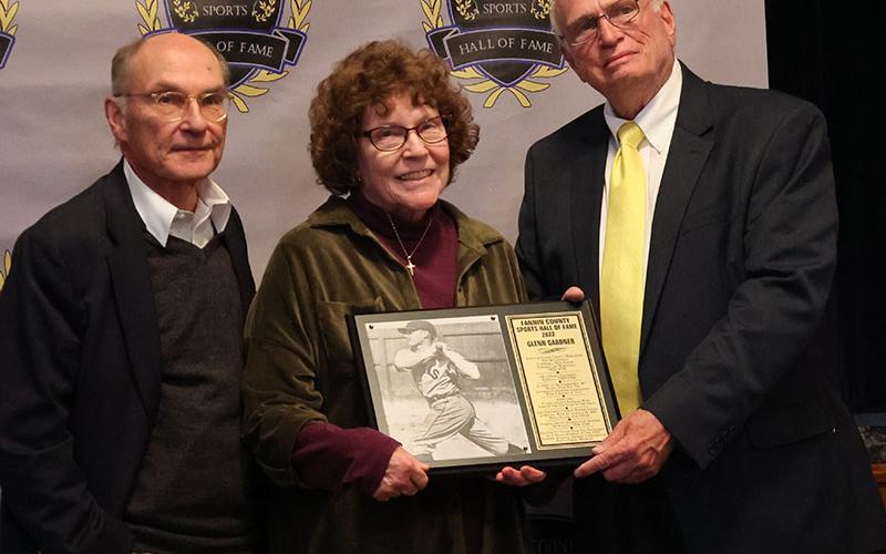 Glenn Gardner’s plaque was received by his son Joe Gardner, left, his daughter, Glenda Wattenbarger, middle, and was presented by Mike Harper, right.
