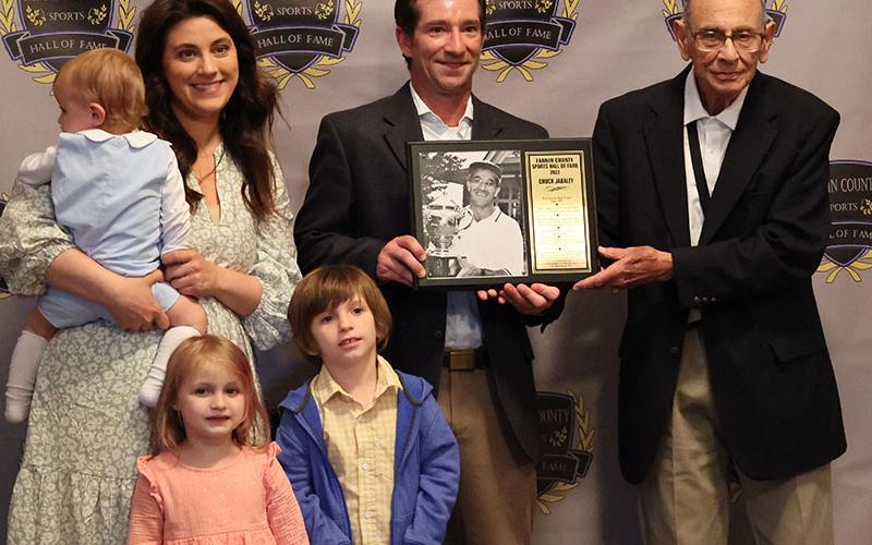 Chuck Jabaley’s plaque was presented to his son Austin Jabaley and family, by Richard Jabaley, right.