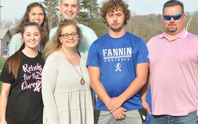 Senior Jackson Davis, shown third from left, was escorted by, from left, front row, sister Courtney Davis, mother Christal Davis, and father Vincent Davis; and back row,  Makenzie McClure and brother Logan Davis.