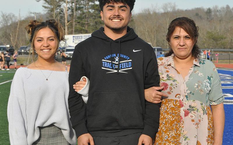 Senior Ricardo Arellanes was escorted by his sister Michell Arellanes, left, and his mother Hidolina Arellanes.