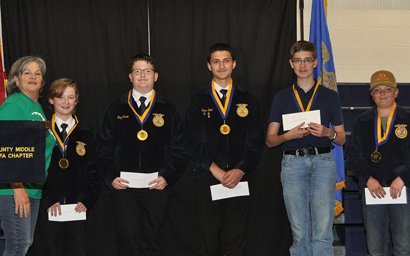 Laurie McClearen presented awards to these Fannin County Middle School FFA chapter members, from left, McClearen, Trenten Flowers, Roy Green, Ethan Deal, James Burrell and Cauy Sutton.