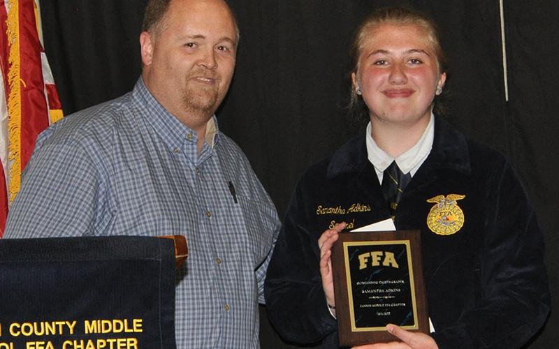 Tim Nicholson presented Samantha Adkins with the Outstanding Eighth Grader award at the Fannin Middle School banquet honoring the school’s FFA chapter.