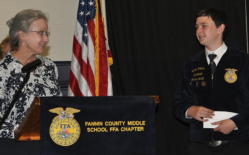 Martha Williams presented Jacob Williams with an award.