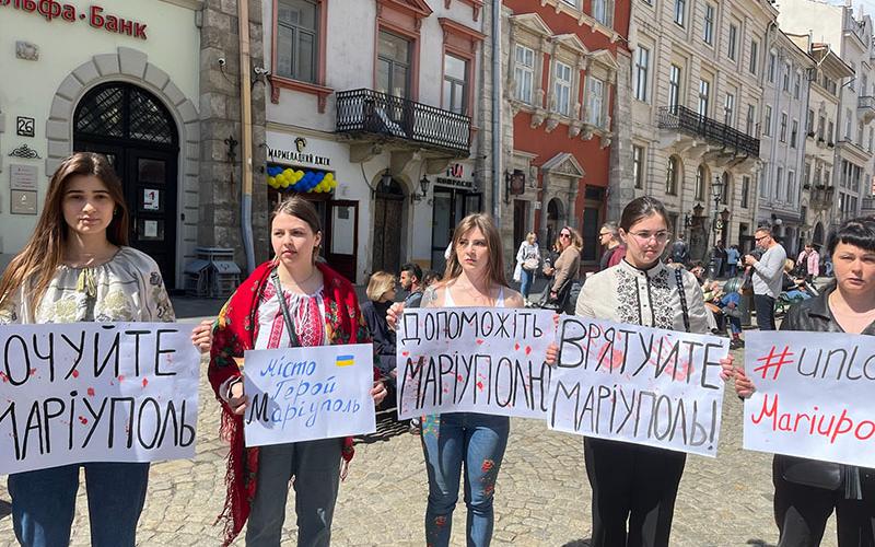 This group of young girls in Mariupol hold signs asking that their city be protected from the invading Russian forces.