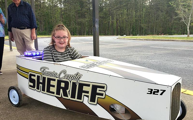 Skylar Gazaway piloted the Fannin County Sheriff’s Office car in the Blue Ridge Soap Box Derby. On the front is her dad’s, Richard Gazaway’s, badge number, 327.