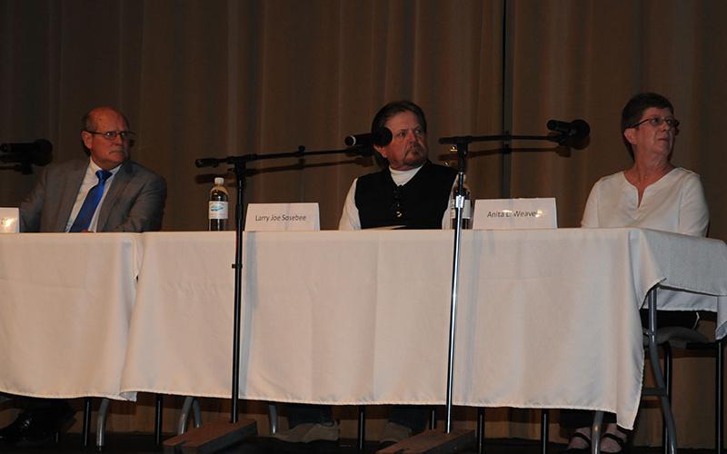 Candidates for Post 2 on the Fannin County Board of Commissioners, from left, incumbent Glenn Patterson, Larry Joe Sosebee and Anita Weaver listen to a question during the Political Forum sponsored by  the Fannin County Chamber of Commerce.
