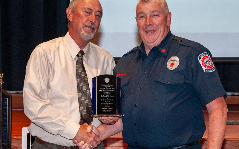 Fannin County Emergency Management Agency Director Robert Graham is presented the James H. Creel Jr., EMS Pioneer of the Year Award by David Newton, retired director of t he Georgia Office of EMS and Trauma