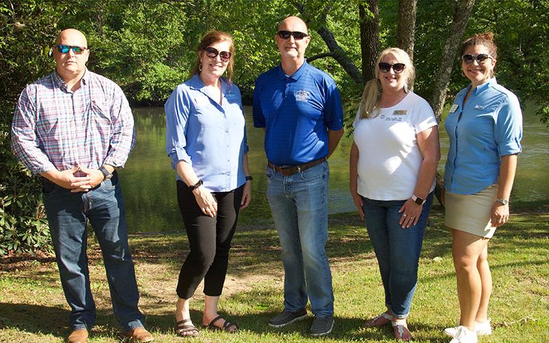 Polk and Fannin County Chambers of Commerce made an appearance at the fly fishing event to show community support. Shown, from left, are Fannin County Recreation and Chamber representative Brandon Holloway, Director of Tourism Services and Development Jode Mull, Recreation Director Eddie O’Neal, Director of Polk County Chamber of Commerce Lynne McClary and President of Fannin County Chamber of Commerce Christie Gribble.