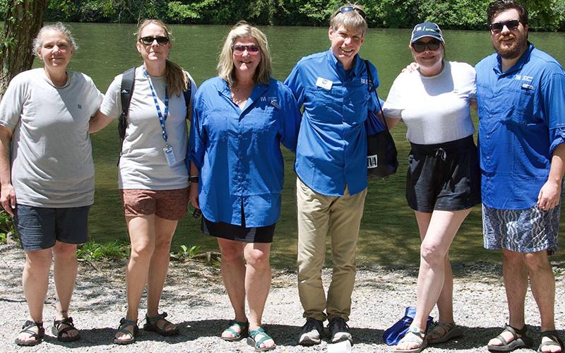 In between the upper and middle sections of the Ocoee River, TVA hosted a lunch hour where all participants could gather together to socialize and take a break from the strenuous activity. TVA representatives shown are, from left, Natural Resources Specialist Beth Cooke, Natural Resources Senior Program Manager Suzanne Fisher, Field Marketing and Communications Specialist Kelley Murray, TVA Media and Relations Specialist Scott Fielder, Communications Partner Pam Anderson and Social Media Coordinator Andrew