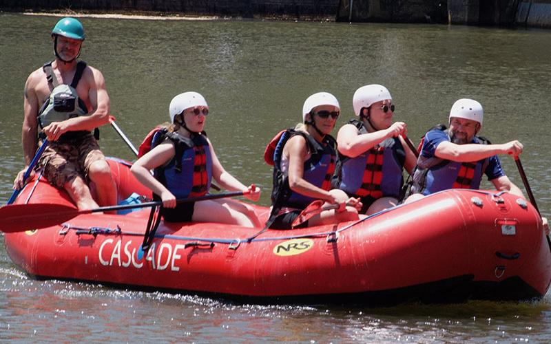 Shown is Ocoee River guide at Cascade Outdoors Joe Norwood as he steers a group of TVA Media Day participants to the middle Ocoee put-in.