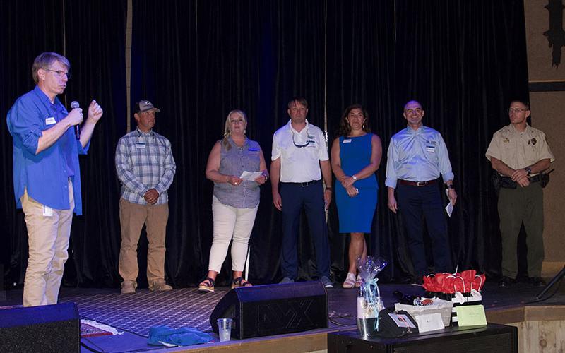 Shown, from left, speaking at the TVA Media Reception held at Tooney’s Music Venue in McCaysville, are TVA Media Relations Representative Scott Fielder, Toccoa River Outfitters &amp; Fly Shop Owner Andrew Bruce, Director of Polk County Chamber of Commerce Lynne McClary, President of Ocoee Whitewater Outfitters Association Ryan Cooke, President of Fannin County Chamber of Commerce Christie Gribble, TVA Representative Bob Dalrymple and Tennessee State Parks Manager Angelo Giansante.