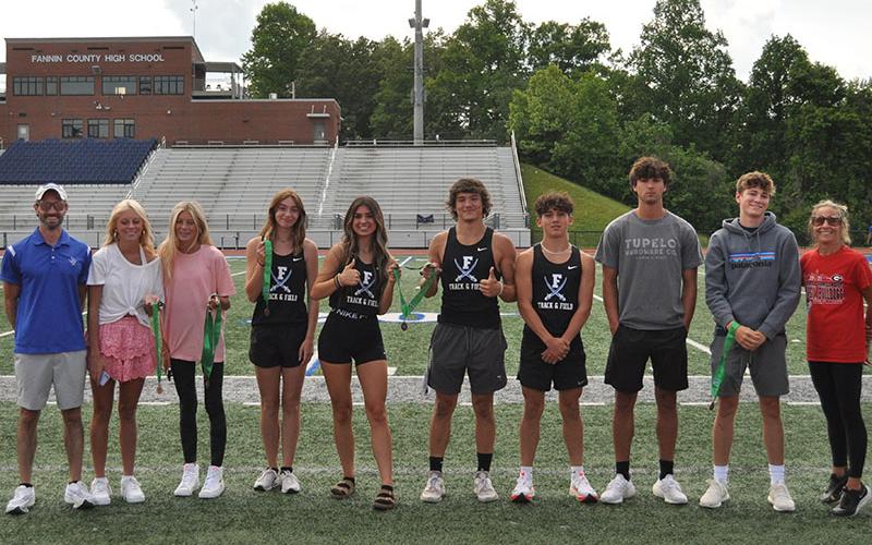 The Fannin County High School track and field teams competed in the 2A State Championship May 12, May 13 and May 14. The athletes photographed made the podium in their event(s). Shown are, from left, Coach Lucas Roof, Carlee Holloway, Lindsey Holloway, Caylee Gaddis, Monica Consentino, Corbin Davenport, Zechariah Prater, Hayden Lynch, Tyler Stevenson and Head Coach Miranda Roof.