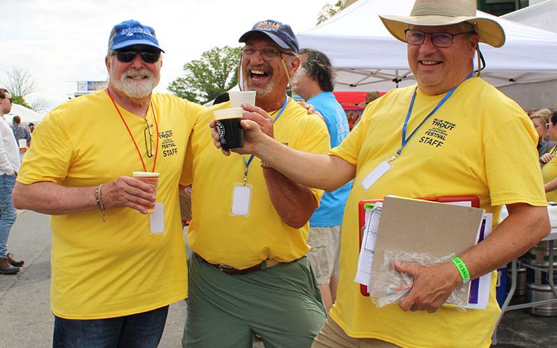 Local Blue Ridge Mountain Trout Unlimited chapter members and Blue Ridge Trout and Outdoor Adventures Festival planning committee members, from left, Sam Miller, Joe Vivenzo and Bob Wetzsteon, cheers to a successful Trout Fest Saturday, April 30.
