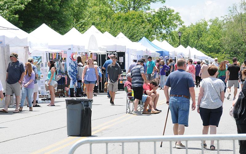 Visitors to the 46th annual Arts in the Park were able to casually visit the 170 or so artists and vendors booth as downtown streets were closed to traffic in the interest of safety.