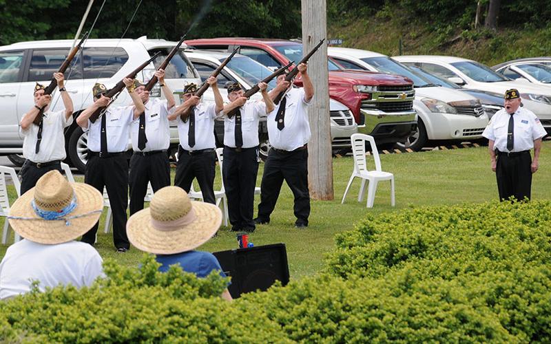 Members of the North Georgia Honor Guard fire a rifle salute during the Memorial Day service in remembrance of those who gave the supreme sacrifice. From left are, Steve Strickland, Nick Wimberley, D.R. Horton, Richard Crosley, John Grizzell, and Paul Hunter. Gerald McMillen, far right, gave commands for the salute.