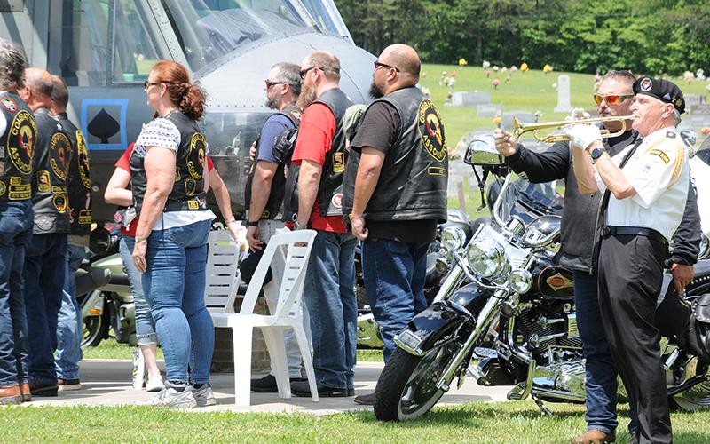 Members of the Combat Veterans Motorcycle Association listen as Taps is played to conclude the Memorial Day service at Veterans Memorial Park.