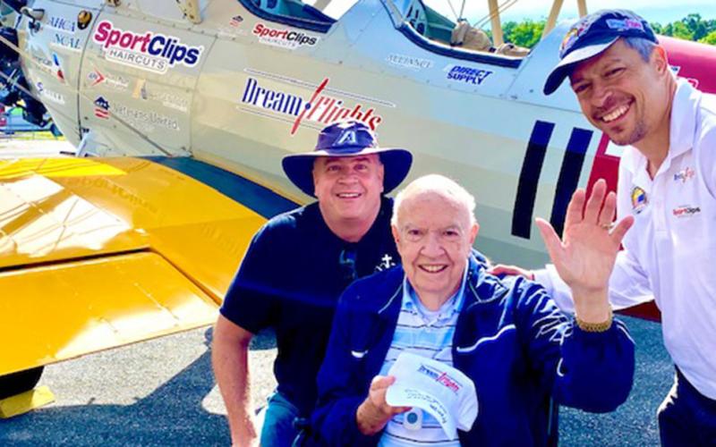 Residents from the Blue Ridge Assisted Living and Memory Care took to the skies Friday, June 10, for a Dream Flight. Shown with the pilot is Gene Bennett, center, and son, Ken Bennett, left.