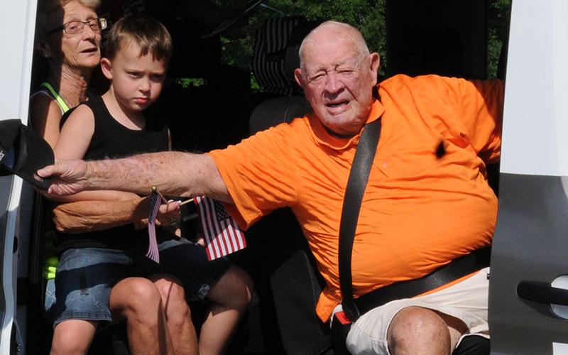 Joe Brandon waved from the Disabled American Veterans (DAV) van Saturday. The parade preceded the Independence Day ceremony held at Veterans Memorial Park.