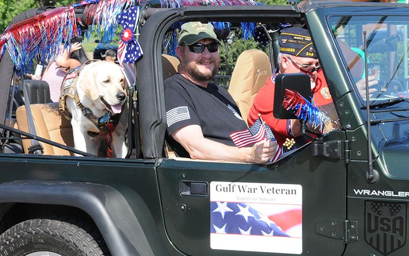 Gulf War veteran Shane Baugh and a friend enjoyed their ride through downtown Blue Ridge in the parade July 4.