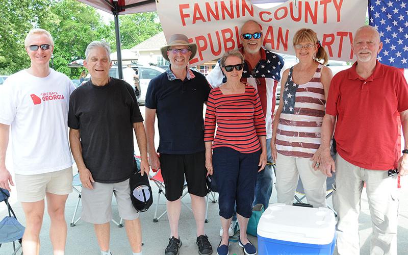 Members of the Fannin County Republican Party were on hand in McCaysville Saturday evening to say Happy Fourth of July with candy for the young and young at heart, and water to help quench the effects of the Saturday heat. Shown are, from left,  party Chairman Frank Wood, Mark Mitchell, Ben Thatcher, Nancy Thatcher, Charles Hukriede, Marsha Dunn, and Fred Cory.