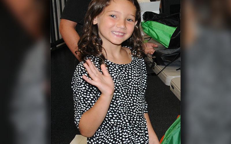 Ellie was all smiles at the Summer Bash, turning to wave when she saw the camera.