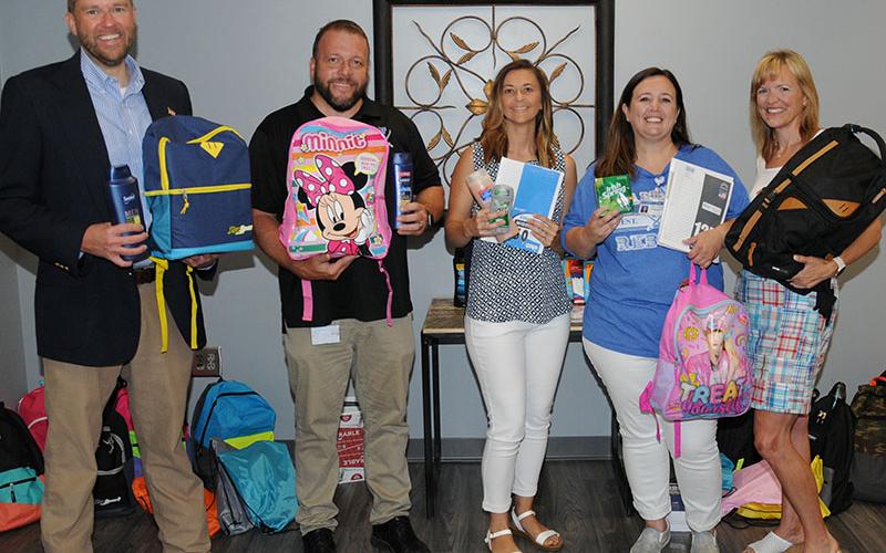Fannin County School System leaders have been busy collecting items and preparing for Saturday’s Summer Bash. Shown with some of the supplies to be given from to students are, from left, Dr. Michael Gwatney, Dr. Scott Ramsey, Sheena Rymer, Tara Cantrell and Shannon Miller.