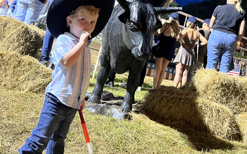 The Wild West Show &amp; Rodeo was held July 1 and 2 in Copperhill as part of celebration for the Fourth of July. Shown enjoying the show is Silas Smith.