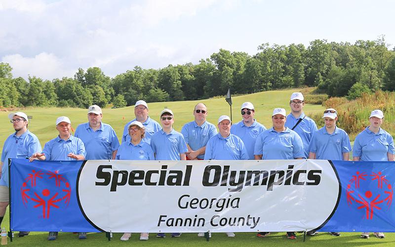 Fannin County Special Olympic participants smile at the Golf Skills event at Old Toccoa Farm Tuesday, July 19. Shown are, from left, Brandon Craig, Jay Jenkins, Kevin Turner, Kari Castlen, Rick Kruse, Alex Hughes, Tommy Cornett, Eric Morris, Michael Elliot, Amanda King, Riley Post, Jonathan Waters and Ansley Price.