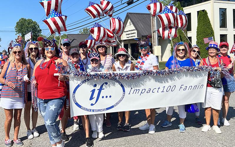 Members of Impact100 Fannin walked in the Old Timers Parade July 4 through downtown Blue Ridge.
