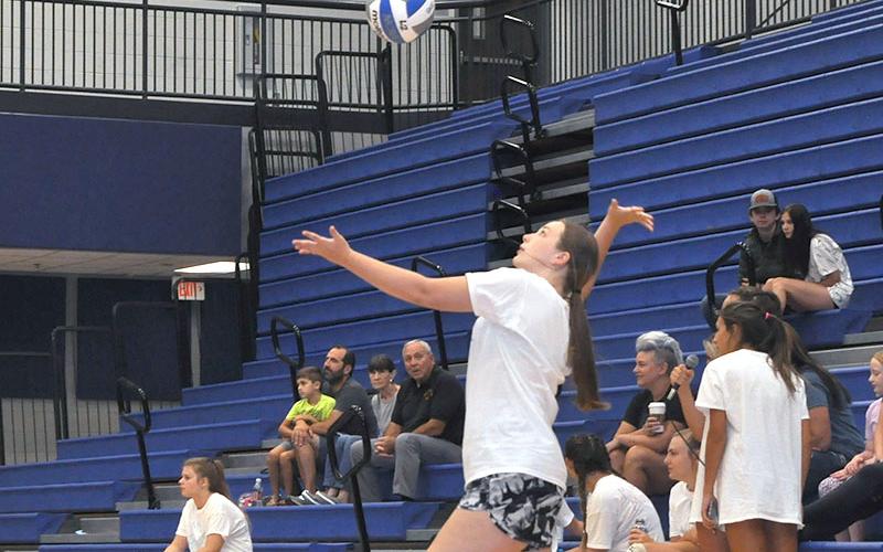 Middle School player Addy Barnes positions herself for a serve during the team tournament Thursday, July 14.