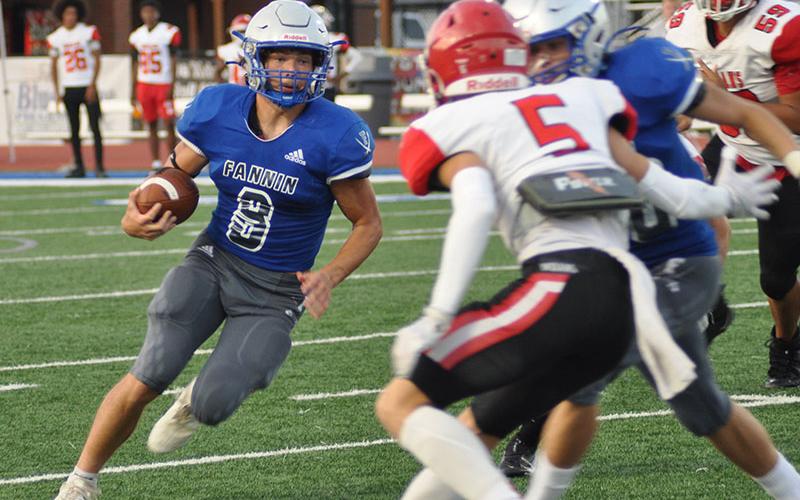Senior quarterback Corbin Davenport (8) runs the ball during the second quarter in the preseason scrimmage against Stephens County High School Friday, August 12.