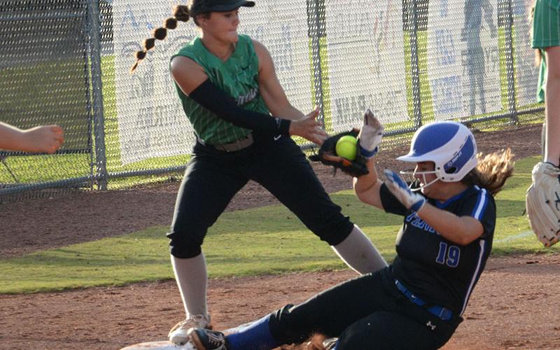 Joselyn Wood (19) slides into third during the match-up against Murray County Thursday, August 25.