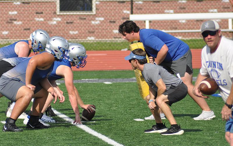 Fannin County High School football linemen work with Offensive Coordinator Chris Thigpen and  Defensive Line Coach Jacob Reece at practice Wednesday, July 27.