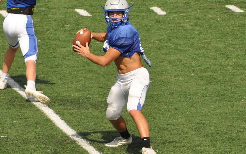Senior Corbin Davenport winds up to throw a pass in practice last week as he prepares for the Rebels’ scrimmage Friday night against Stephens County.