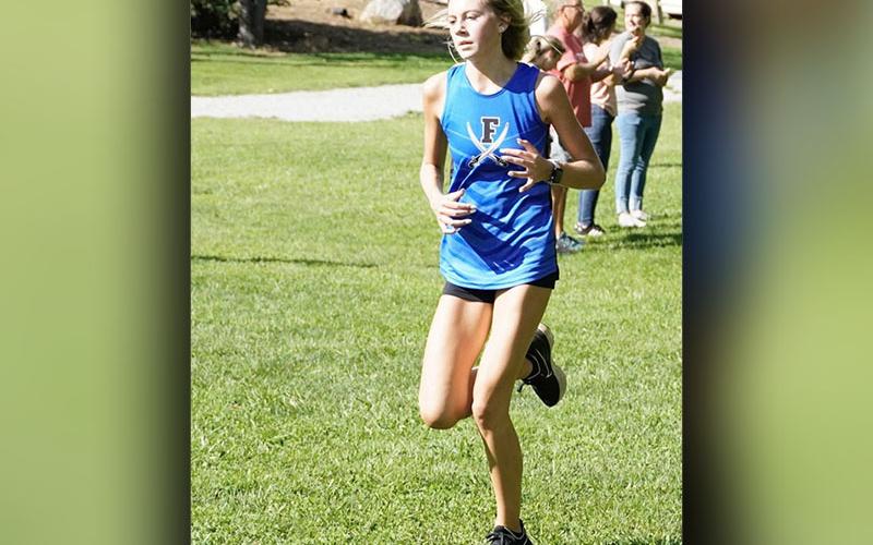 Lindsey Holloway makes her way to the finish line during the race at Meeks Park Saturday, August 26. Holloway placed second in the girls’ division.