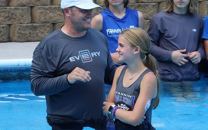 Matt Queen, left, and Annaleigh Cheatham, right, smile just before her baptism Tuesday, September 6. Cheatham along with eight others were baptized that afternoon.