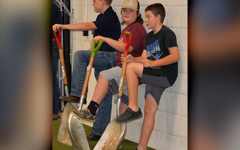 Ready to tackle the dirty jobs at the youth fair are, from left, Dakoda Moore Jake Ware and Wyatt Flowers, all members of the FFA at Fannin County Middle School.